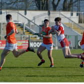 Derry's Peter McCullagh nips in ahead of two Armagh defenders during the Oak Leafers' championship victory in Owenbeg on Sunday.