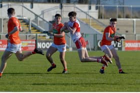 Derry's Peter McCullagh nips in ahead of two Armagh defenders during the Oak Leafers' championship victory in Owenbeg on Sunday.