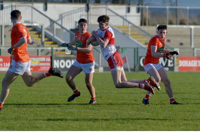 Derry's Peter McCullagh nips in ahead of two Armagh defenders during the Oak Leafers' championship victory in Owenbeg on Sunday.