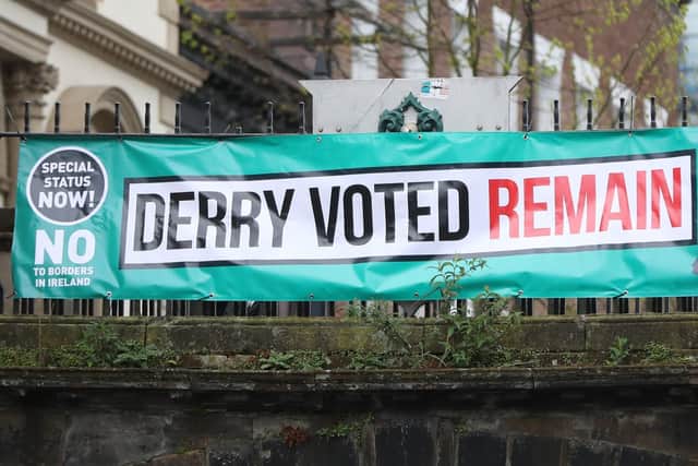 A banner reading "Derry voted remain" hung from the city's walls as the EU's chief Brexit negotiator Michel Barnier arrived to meet business stakeholders and cross-border groups at the Guildhall earlier this year. (Niall Carson/PA Wire)