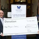 Kieran Kennedy, Managing Director of O’Neills, presents a cheque for £3,000 on behalf of the company to Mayor of Derry City and Strabane District Council, Councillor Brian Tierney for the Mayor’s charity, Aurora Counselling. 2112ON12