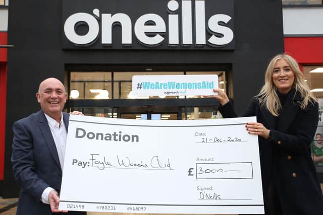 Kieran Kennedy, Managing Director of O’Neills, presents a cheque for £3,000 on behalf of the company to Foyle Women’s Aid Finance Director Ciara McDonough.