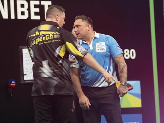 Things get heated at the end of the Premier League match between Daryl Gurney and Gerwyn Price in Sheffield in 2019 as referee, George Noble and security have to intervene.
