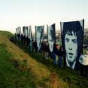Portraits of the Bloody Sunday victims overlooking the city in 2011.