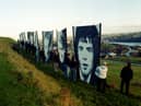 Portraits of the Bloody Sunday victims overlooking the city in 2011.
