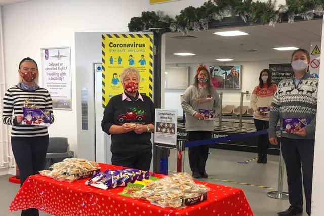 First class service for all.... Steve Frazer with Airport staff  Laura Slevin, Kay Doherty, Leona Mullan, Julie McFadden with some of the treats offered to passengders over Christmas.