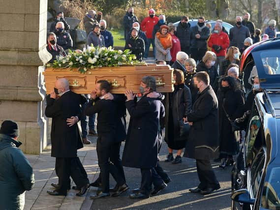 Relatives carry the coffin of Derry City FC legend Willie Curran into St Eugene’s Cathedral, for Requiem Mass this afternoon (Wednesday). Photo: George Sweeney. DER2102GS – 003