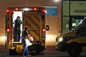 Medical staff attending to patients in an ambulance, at Antrim Area Hospital, Co Antrim in Northern Ireland.