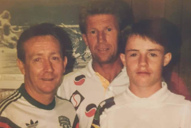 Former Man City youth Joe Harkin (right) pictured with City legend Colin Bell and his father, Charlie when signing his contract during the early 90s.