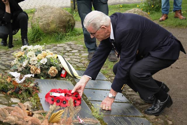 Harry lays a wreath at Bunker Valentin.