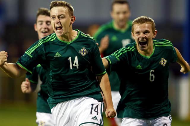 Mikhail celebrates scoring for Northern Ireland against Mexico in the 2014 Milk Cup