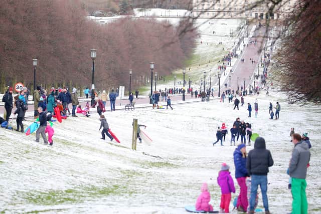 People enjoy the snow at Stormont in east Belfast. (Photo: Jonathan Porter/PressEye)
