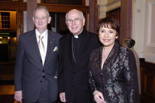 The late Tom McGinley with Bishop Daly and Dana.