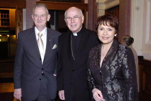 Dr Tom McGinley pictured with the late Bishop Daly and Dana.