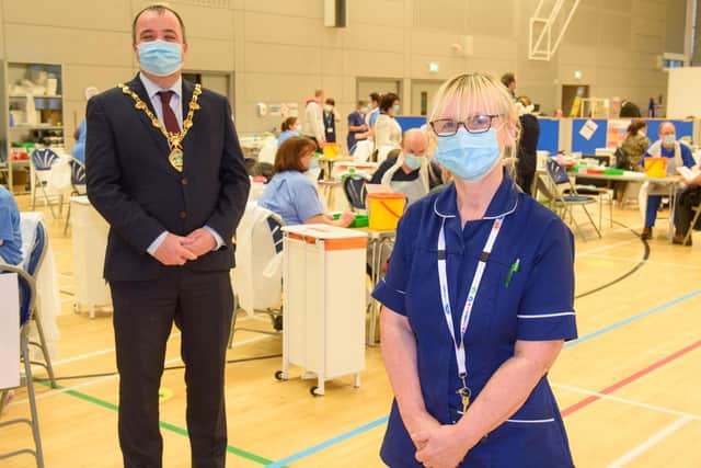 Sylvia Crawford who is one of the retired WHSCT staff who has answered the call to help deliver the Covid-19 vaccine pictured with  Councillor Brian Tierney, Mayor of  Derry City and Strabane District Council, when he visited the   Covid -19 mass vaccination centre in the Foyle Arena. Picture Martin McKeown. 28.01.21