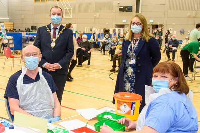 Councillor Brian Tierney, Mayor of  Derry City and Strabane District Council, visits the Covid -19 vaccination centre in the Foyle Arena where he met Western Health and Social Care Trust staff who are delivering the vaccine programme. Included are Dr. alan McKinney who is one of the retired doctors to help during the pandemic, Anne McConnell, HR Director WHSCT and School nurse Geraldine Mulholland.   Picture Martin McKeown. 28.01.21