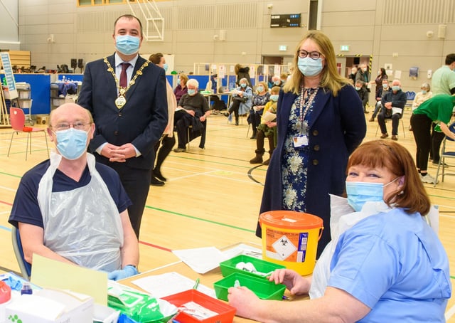 Councillor Brian Tierney, Mayor of Derry City and Strabane District Council, visits the Covid -19 vaccination centre in the Foyle Arena where he met Western Health and Social Care Trust staff who are delivering the vaccine programme. Included are Dr. alan McKinney who is one of the retired doctors to help during the pandemic, Anne McConnell, HR Director WHSCT and School nurse Geraldine Mulholland. Picture Martin McKeown. 28.01.21