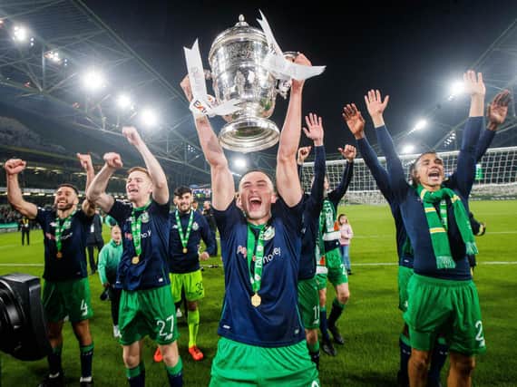 Aaron McEneff holds aloft the FAI Cup after their penalty shoot-out win over Dundalk in 2019.