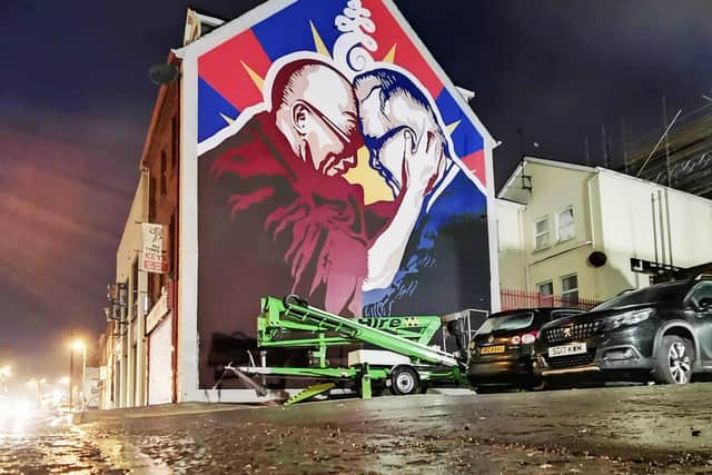 The new mural featuring the Dalai Lama and Richard Moore.