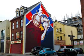 A new mural at Great James Street, created by local artists UV Arts, depicts the friendship between His Holiness the Dalai Lama and Derry local man Richard Moore.  DER2105GS – 03