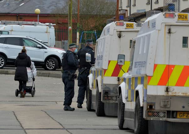 PSNI officers pictured on Sunday morning, at the scene of a double paramilitary style shooting at Rinmore Drive, Creggan. The shootings took place on Saturday evening. DER2106GS – 020