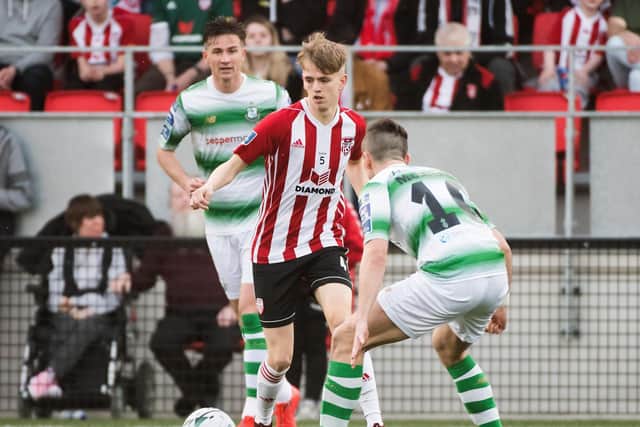 Harkin pictured in action against Shamrock Rovers' Aaron McEneff and Ronan Finn at Brandywell during the successful 2019 season.
