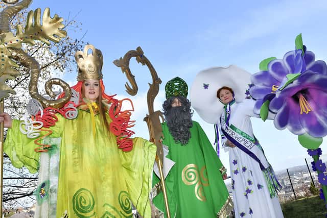 2018: Stilt walkers Audrey Doherty (Brigid), Michael Johnston (St. Patrick) and Sorcha Shanaghan (Suffragette) who featured in the annual St. Patrick's Day parade. DER1118-129KM