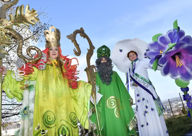2018: Stilt walkers Audrey Doherty (Brigid), Michael Johnston (St. Patrick) and Sorcha Shanaghan (Suffragette) who featured in the annual St. Patrick's Day parade. DER1118-129KM