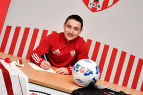 Midfielder Joe Hodge signs his loan deal agreement with Derry City. Picture by Kevin Morrison/Event Images & Video