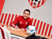 Midfielder Joe Hodge signs his loan deal agreement with Derry City. Picture by Kevin Morrison/Event Images & Video