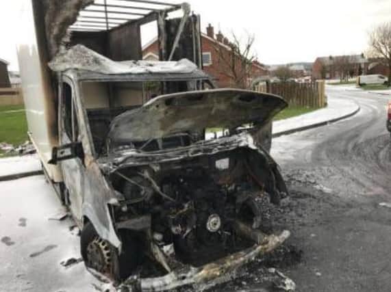 The torched shell of the van in Galliagh.