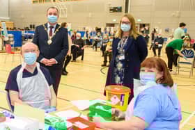 Councillor Brian Tierney, Mayor of  Derry City and Strabane District Council, visits the Covid -19 vaccination centre in the Foyle Arena where he met Western Health and Social Care Trust staff who are delivering the vaccine programme. Included are Dr. alan McKinney who is one of the retired doctors to help during the pandemic, Anne McConnell, HR Director WHSCT and School nurse Geraldine Mulholland.   Picture Martin McKeown. 28.01.21