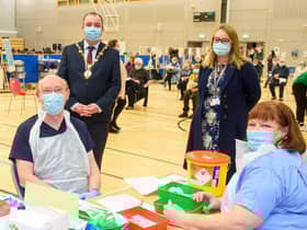 Councillor Brian Tierney, Mayor of  Derry City and Strabane District Council, visits the Covid -19 vaccination centre in the Foyle Arena where he met Western Health and Social Care Trust staff who are delivering the vaccine programme. Included are Dr. alan McKinney who is one of the retired doctors to help during the pandemic, Anne McConnell, HR Director WHSCT and School nurse Geraldine Mulholland.   Picture Martin McKeown. 28.01.21