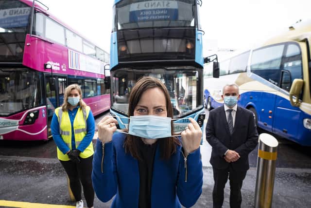 Infrastructure Minister Nichola Mallon, pictured previously with Translink Group Chief Executive Chris Conway and Translink’s Nicole Green (left) reminding everyone that face coverings are compulsory when travelling on public transport.