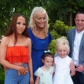 Tamzin White, pictured with her father, James, sisters Farrah and Lola-May and late mother, Louise.