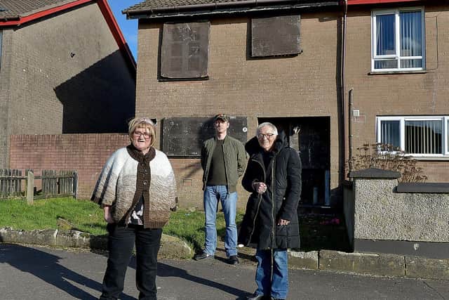 Monica Harkin (right) and her daughter Joanne, who have welcomed the GCR group’s securing of an adjacent derelict property in Fergleen Park pictured with Colly McLaughlin, from the Gallaigh Community Response group.  Photo: George Sweeney / Derry Journal.  DER2108GS – 024
