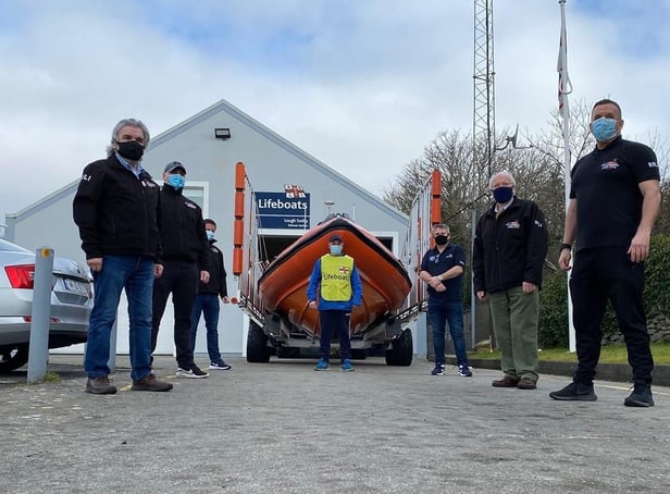 Seamus, pictured at the far back, sets off yesterday. He is supported by his RNLI colleagues.