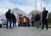 Seamus, pictured at the far back, sets off yesterday. He is supported by his RNLI colleagues.