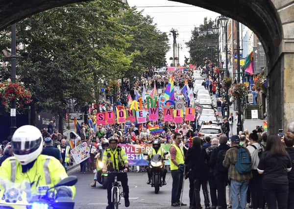 A previous Foyle Pride Festival parade makes it's way down Shipquay Street. DER3519-117KM
