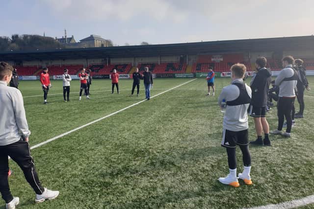 Clinical psychologist and family therapist, Gerry Cunningham introduces himself to Derry City players at training on Tuesday.