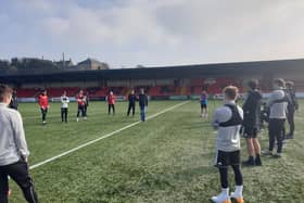 Clinical psychologist and family therapist, Gerry Cunningham introduces himself to Derry City players at training on Tuesday.