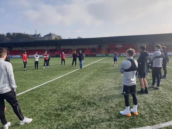 Clinical psychologist and family therapist, Gerry Cunningham introduces himself to Derry City players at training on Tuesday.