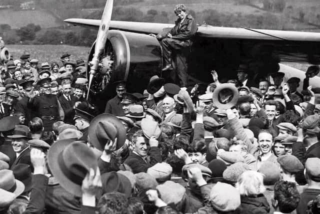 May 1932... Amelia Earhart and her Lockheed Vega are surrounded by scores of locals at Ballyarnett in Derry.