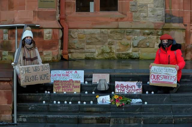 Hannah McIvor and Ciara Oâ€TMConnor-Pozo placed candles, flowers and placards on the Guildhall steps on Saturday evening last in remembrance of  Sarah Everard. Photos: George Sweeney / Derry Journal.  DER2110GS â€“ 108