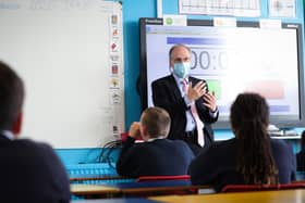Education Minister Peter Weir speaking with school pupils last year. Photo by Kelvin Boyes / Press Eye.