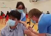 Health staff administering vaccinations in Omagh.