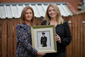 Sisters Leona Melly and Claire Barber hold a photograph of the late father NIFSR Station Commander Kieran Barr. Photo: George Sweeney. DER2111GS -