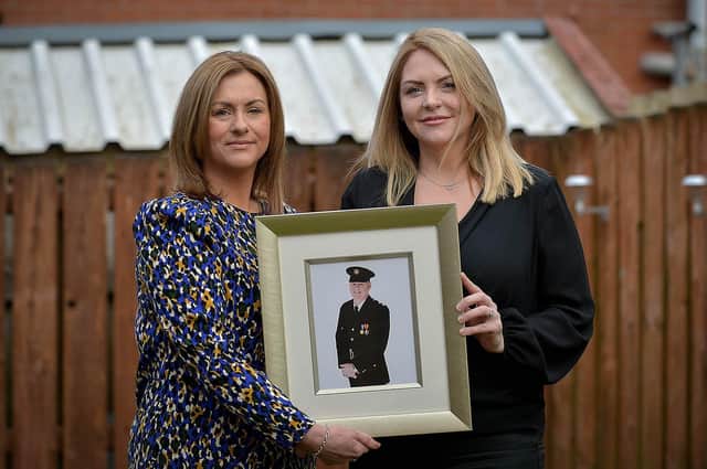 Sisters Leona Melly and Claire Barber hold a photograph of the late father NIFSR Station Commander Kieran Barr. Photo: George Sweeney. DER2111GS -