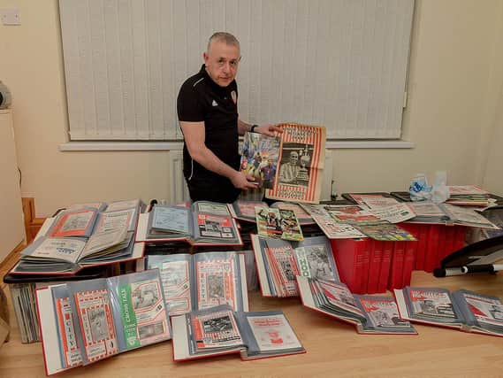Derry City's club historian Brian Dunleavy with his impressive collection of match programmes dating back from the club's first ever League of Ireland game in 1985 right through to the final match fans were permitted into the Brandywell last year.