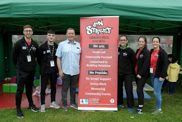 2019: Tommy McCallion (fourth from left) and Aileen Mellon (far right) with  On Street Community Youth event organisers, pictured at the 2019 Galliagh Community Festival.  DER3119GS-003